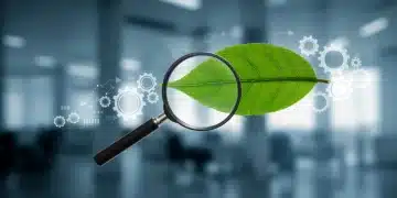 Magnifying glass over a green leaf, symbolizing scrutiny of environmental marketing claims and FTC compliance